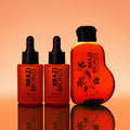 Two bottles of Sunkissed Self-Tan Face Drops with the free travel size tanning oil