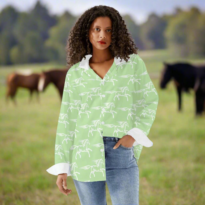 girl in light green button-up long sleeve shirt with horse print.